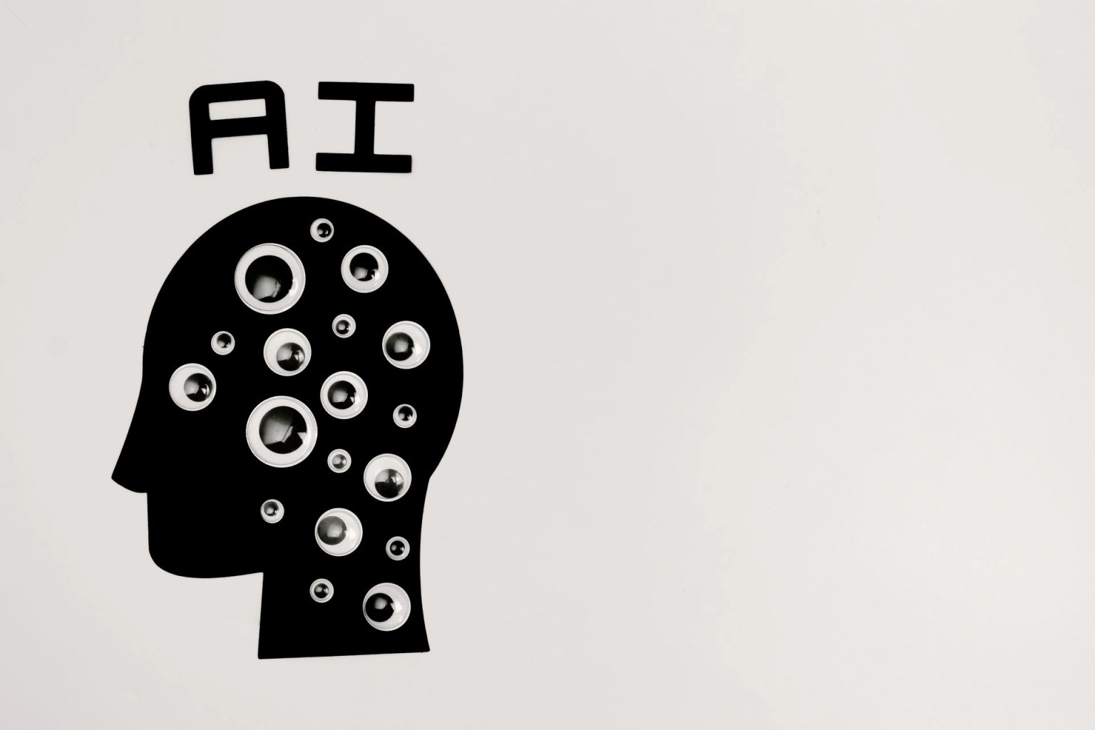 Ilustracion con las siglas AI y la silueta de una cabeza, imagen para una guia sobre calidad de datos para proyectos de inteligencia artificial.