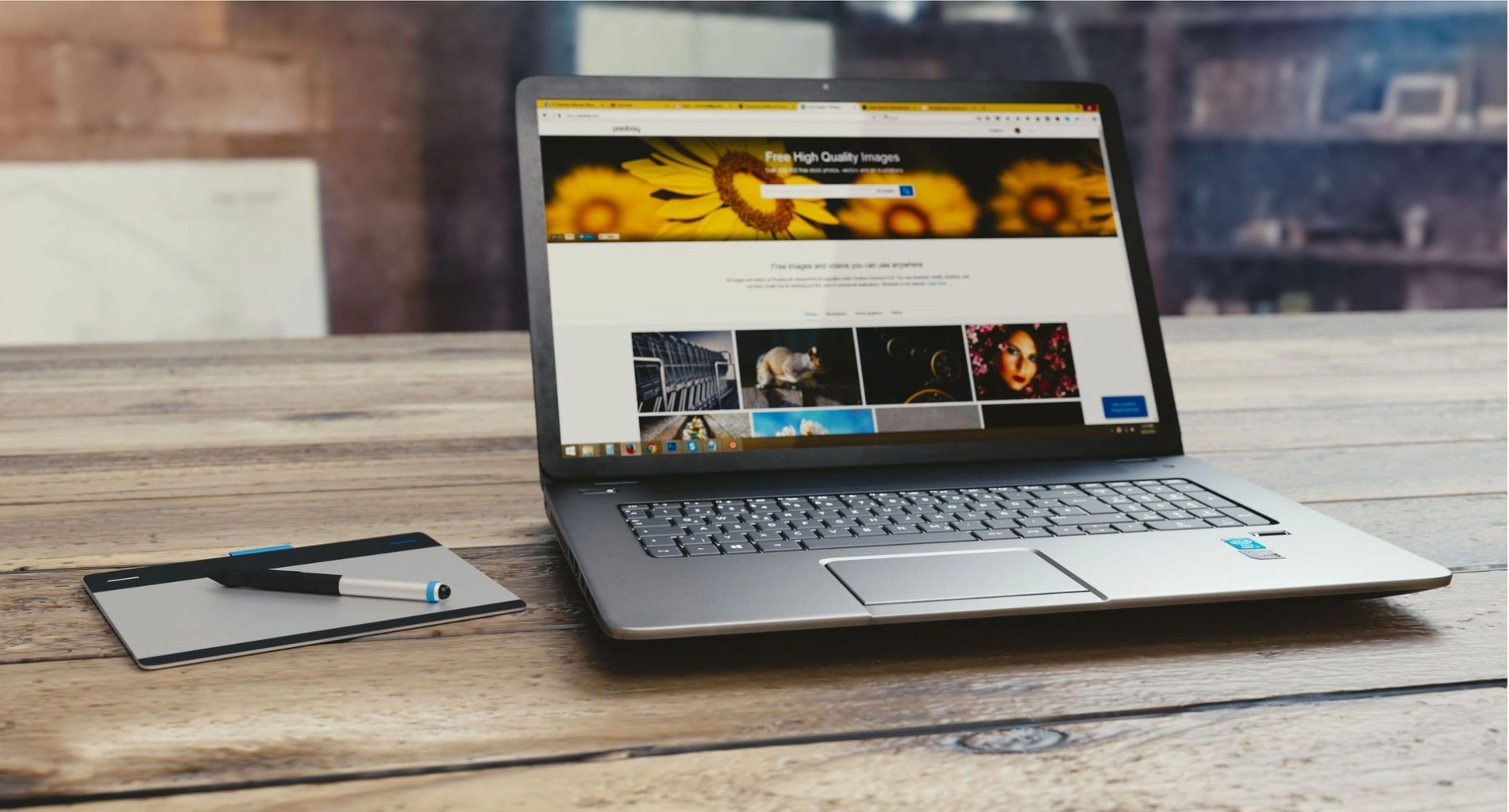 Laptop on a desk displaying a website, illustrating the creation of a small business website.